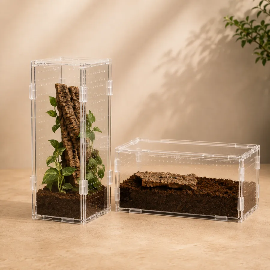 A tall arboreal enclosure and a wide terrestrial enclosure side by side, each vented for its species
