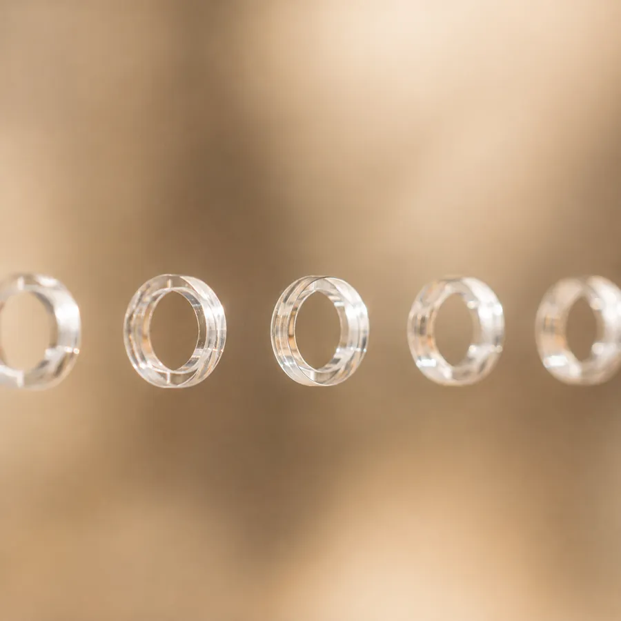 Macro view of the drilled ventilation holes in a clear acrylic panel